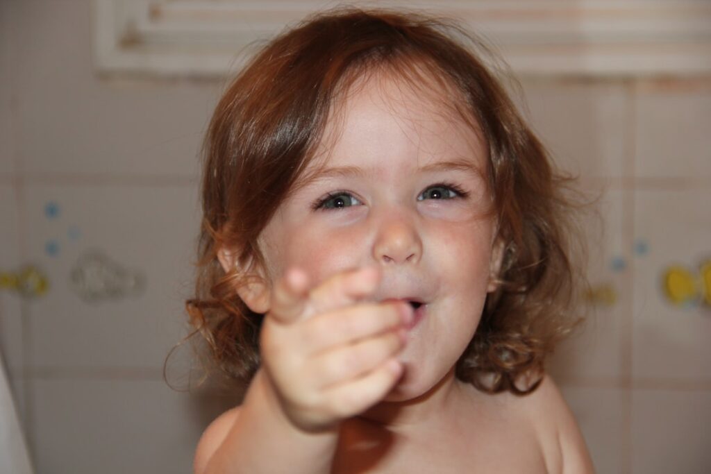 girl with brown hair smiling