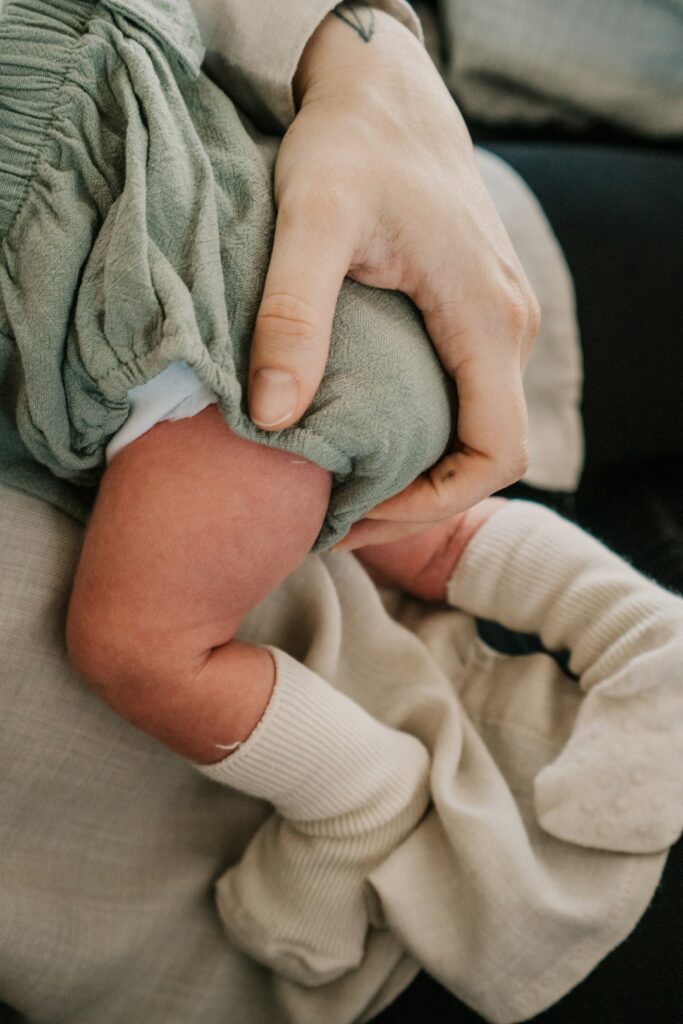 a person holding a baby in their arms
