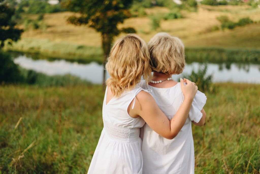 two women in wedding dresses